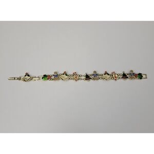 VTG Avon Gold Tone Christmas Sliding Charm Bracelet Bells Candy Canes Trees